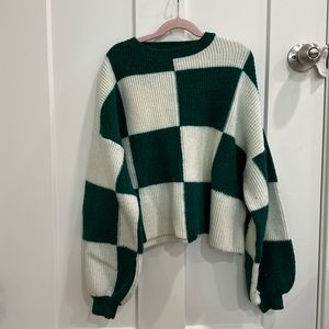 Green check knit sweater.